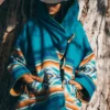 Yellowstone Beth Dutton blue coat – iconic Aztec wool hooded poncho