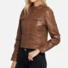 Women’s light brown cafe racer lambskin leather jacket with quilted lining, zipper closure, and band collar