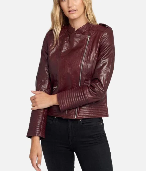 Women’s maroon asymmetric leather jacket with angled zipper and quilted shoulders