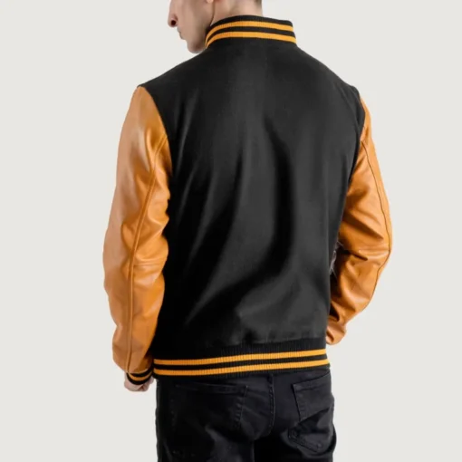 Men’s black varsity letterman jacket with wool body and gold leather sleeves back view